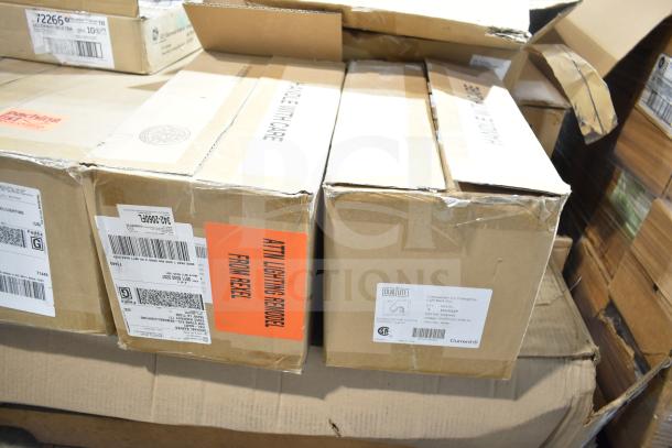 12 boxes of scratch and dent items, including GE ballasts and DualLite LED emergency light back boxes. Labels visible.