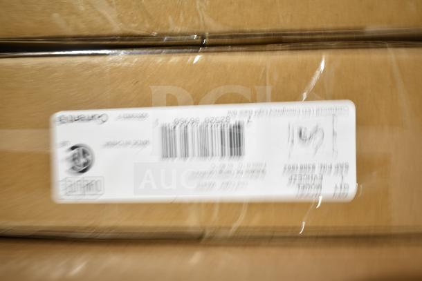 Cardboard box with GE Ballasts and DualLite LED Emergency Light, brand new with minor scratches and dents.