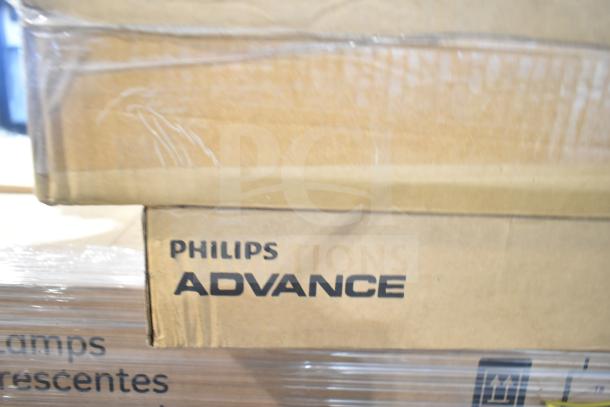 Cardboard boxes labeled "Philips Advance," containing new scratch and dent items like ballasts, fan, and fluorescent lights.
