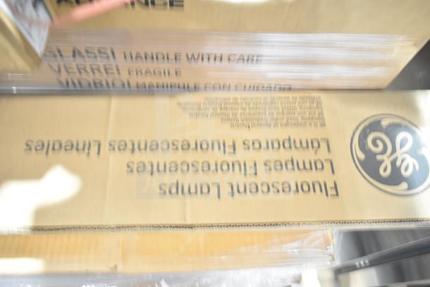 32 new items including ballasts, fan, Philips/GE fluorescent lights. Boxes labeled "fragile." Some scratch and dent.