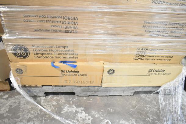 Boxes of GE Lighting fluorescent lamps, brand new with minor scratches and dents, labeled as fragile. Includes 32 items.