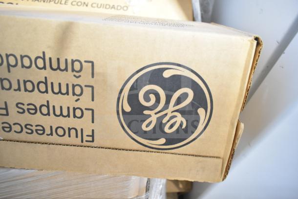 Cardboard box with GE logo containing brand new scratch and dent GE fluorescent tube lights. Packaging is intact.