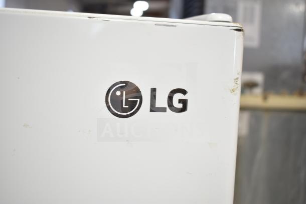 LG LTCS20020W/00 reach-in cooler with freezer, showing LG logo. 115 volts, 1 phase. Minor wear visible.