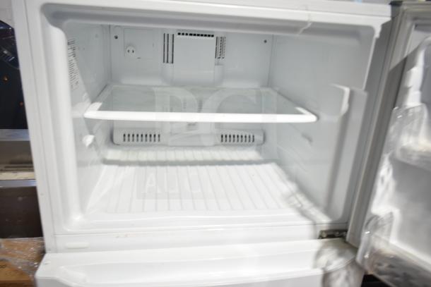 LG LTCS20020W/00 reach-in cooler with freezer, white interior, 115 volts, 1 phase, clean and well-maintained.
