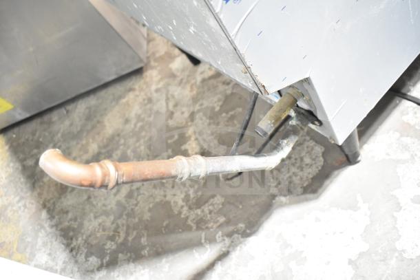 Hoshizaki F-330BAJ ice machine showing external pipe connections, metal finish, condition appears used. 115V, 1 Phase.