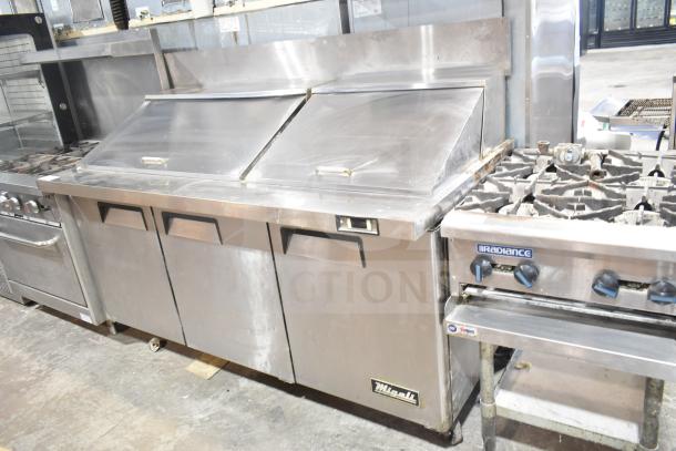Migali C-SP72-30BT commercial sandwich salad prep table with bain marie mega top. Stainless steel, on casters, 115V, used condition.