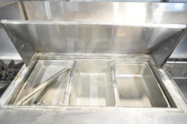 2017 Migali C-SP72-30BT commercial prep table with bain marie top, three stainless steel compartments, on casters.