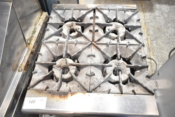 Radiance commercial gas-powered 4-burner countertop range on stand, showing natural wear. Item number 122 visible.