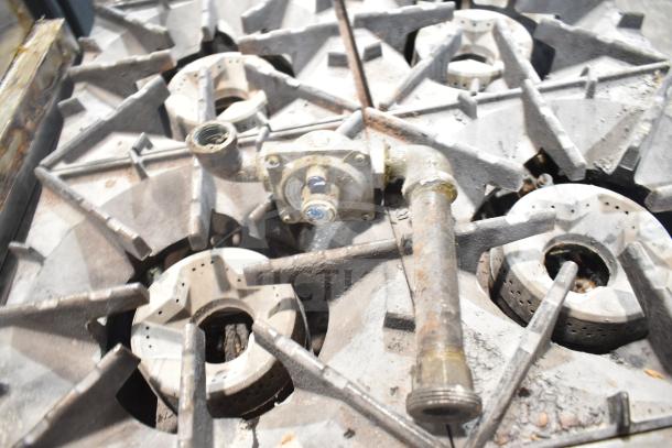 Radiance commercial countertop gas 4-burner range on equipment stand, showing burners and gas connection, in used condition.