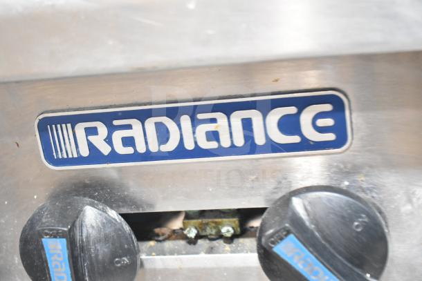 Radiance Commercial 4 Burner Gas Range nameplate, featuring brand logo and control knobs, mounted on equipment stand.