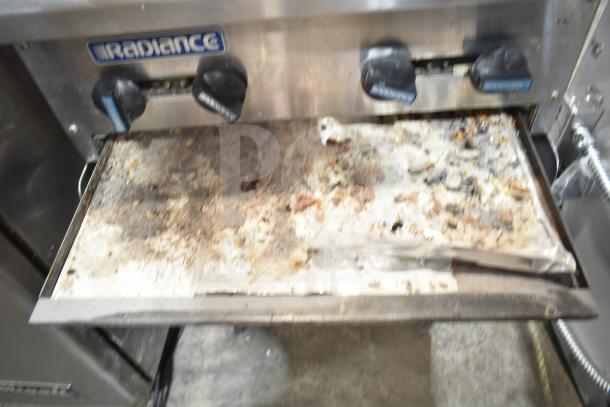 Radiance 4-burner gas range on a countertop stand, worn condition, visible brand label, needs cleaning.