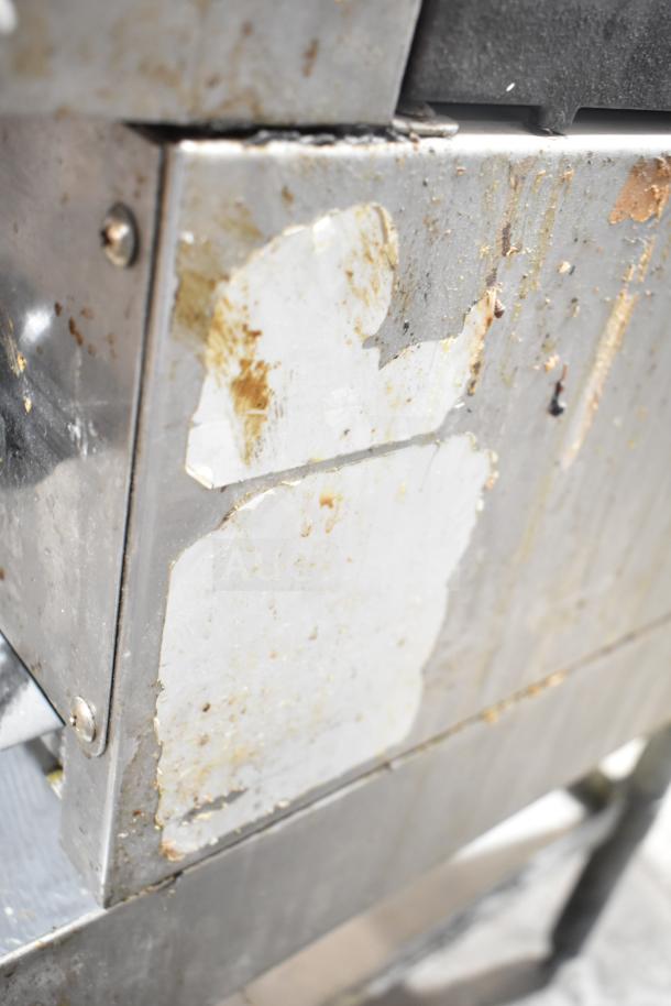 Radiance commercial countertop gas-powered 4-burner range on equipment stand, showing external wear and missing labels.