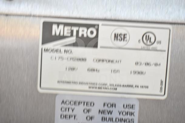Metro C175-CM2000 Heated Holding Cabinet on casters, 120V, commercial use. Labels show model and safety certifications.