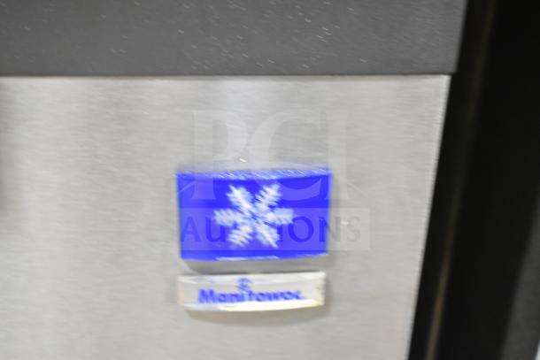 Manitowoc SPA310 commercial ice dispenser, 115 volts, 1 phase. Features a snowflake design and brand logo on the front.