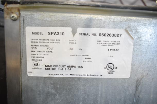Manitowoc SPA310 commercial hotel ice dispenser label, 115 volts, 1 phase, serial no. 050263027, UL listed.