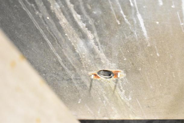 Manitowoc SD0452A ice machine head on SPA310 dispenser, 115V, 1 phase. Visible wear and rust around a metal hole.