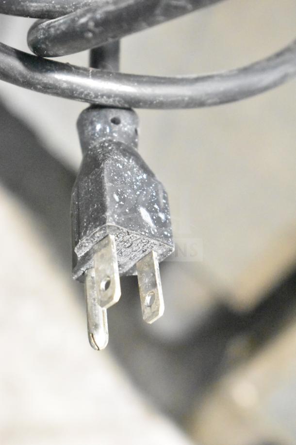 Manitowoc SD0452A ice machine head on SPA310 dispenser, 115V, 1 phase, commercial-grade, visible power plug.