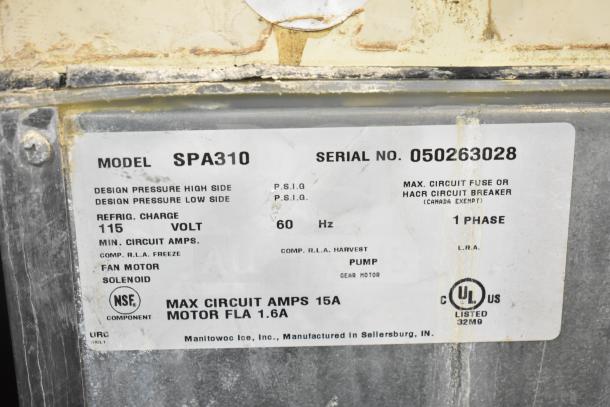 Manitowoc SD0452A ice machine head on SPA310 dispenser label, 115V, 1-phase, model and serial numbers visible, NSF certified.