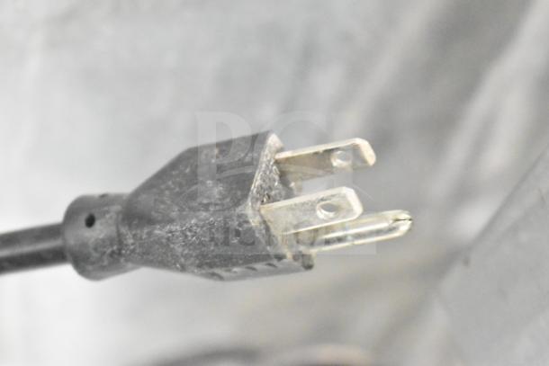 Alt text: Close-up of a Manitowoc ice machine's 115-volt power plug.