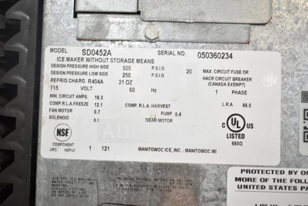 Manitowoc SD0452A Ice Machine label showing model details, 115V, 1 phase, R404A refrigerant, NSF certified.