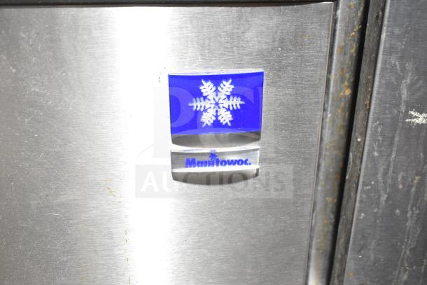 Manitowoc SD0452A ice machine and SPA310 dispenser, brushed metal finish, 115V, 1 Phase, visible logo and minor wear.