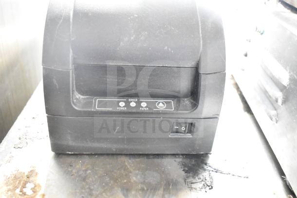 Toast Receipt Printer in black, showing power and error indicators. Slightly worn condition, reflects use.