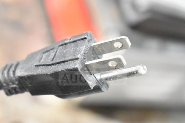 Close-up of power plug for Avantco Countertop Panini Press, showing standard two-prong design, indicative of typical electrical connection.