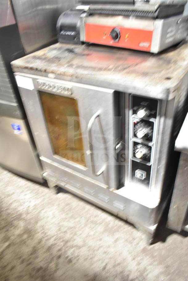 Blodgett commercial gas convection oven with view-through door and thermostatic controls. Slightly worn condition.