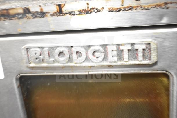 Blodgett commercial gas convection oven, half-size, view-through door, thermostatic controls, visible rust and wear.