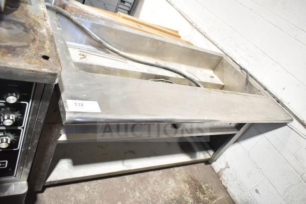 Commercial electric steam table with under shelf, stainless steel, used condition, visible wiring, item tag number 132.