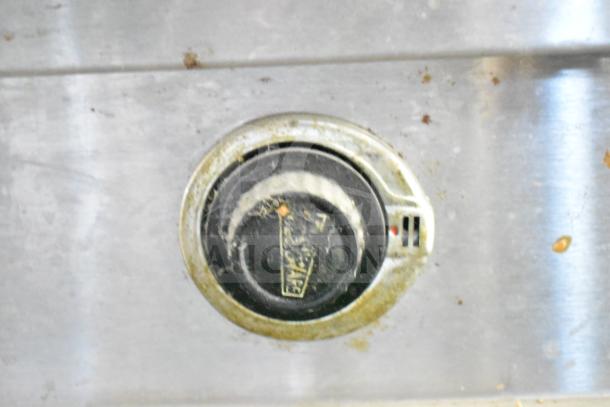 Commercial Electric Powered Steam Table control dial, showing wear, indicative of heavy use.