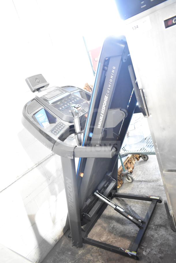 Horizon Folding Treadmill with Variable Response Cushioning. Compact design, good condition, clear control panel.