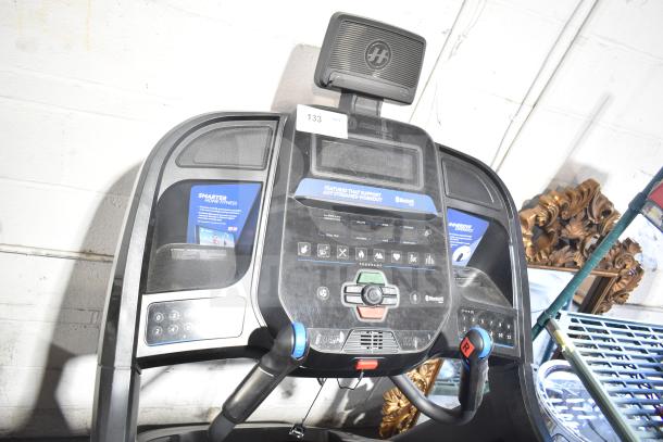 Horizon Folding Treadmill console with digital display, control buttons, and Bluetooth connectivity, in good condition.