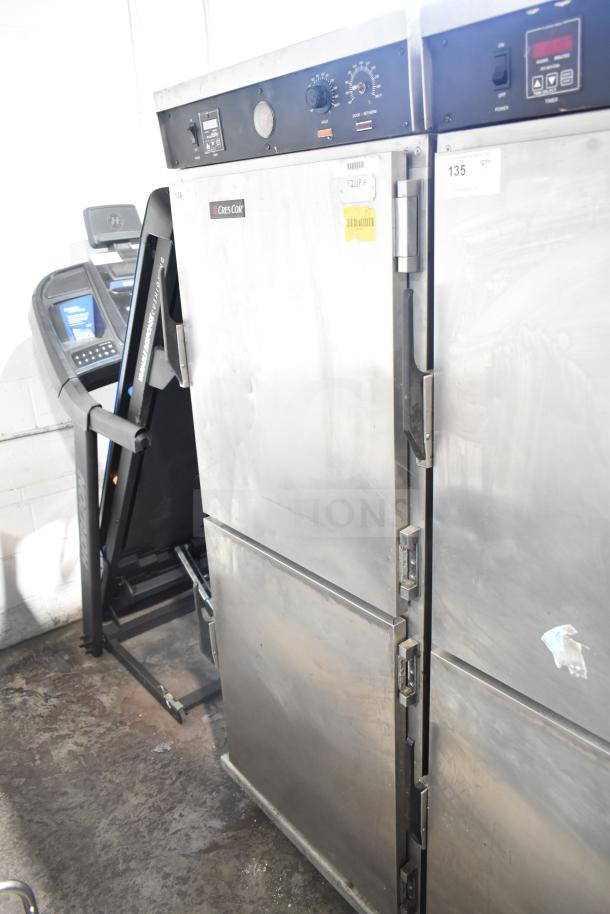CresCor HU18-671-120 heated holding cabinet, metal finish, on casters, dual doors, visible controls, shows wear.