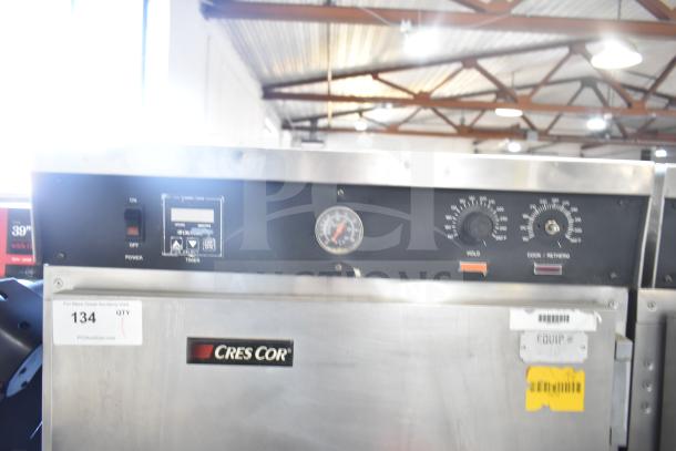 CresCor HU18-671-120 heated holding cabinet with controls on commercial casters. Features temperature gauge and power switches.