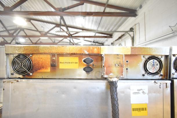 CresCor HU18-671-120 heated holding cabinet with casters, visible wear, rust, and model number tag.
