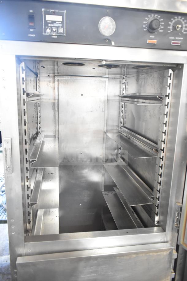 CresCor HU18-671-120 heated holding cabinet with adjustable shelves, digital controls, and commercial casters in used condition.