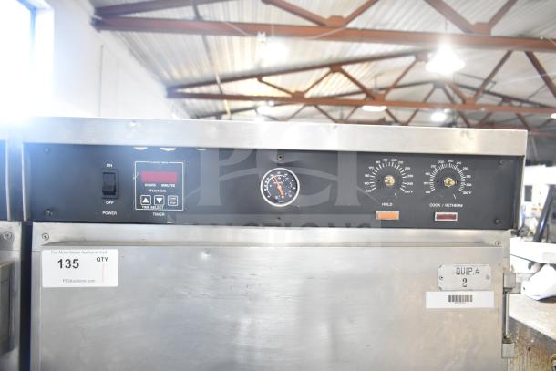 CresCor HU18-671-120 heated holding cabinet with controls, commercial casters, and visible power switch. Item tag "135".