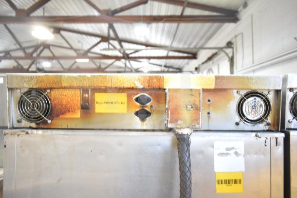 CresCor HU18-671-120 commercial heated holding cabinet, visibly rusted, with model label and commercial casters.