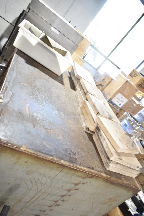 Bakers Pride DS-805 commercial natural gas pizza oven, used condition, visible wear, includes extra bricks, auction item.