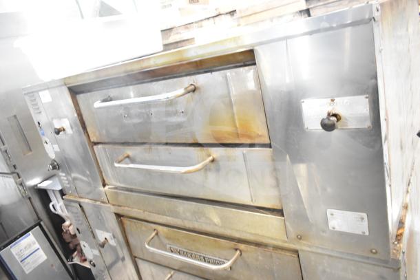 Bakers Pride DS-805 commercial natural gas pizza oven. Single deck, stainless steel, used condition, visible wear.