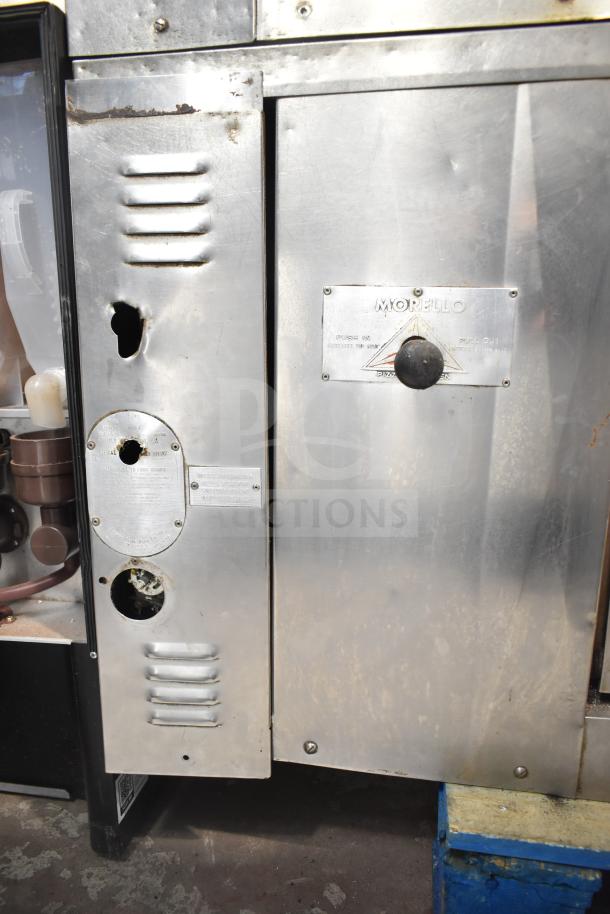 Bakers Pride DS-805 commercial natural gas pizza oven, steel finish, visible wear, single deck, model and safety labels.