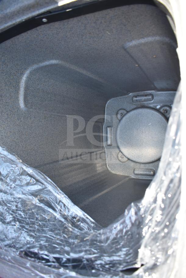 Six gray poly trash cans, interior view. Durable, spacious design, new condition, ideal for outdoor waste management.