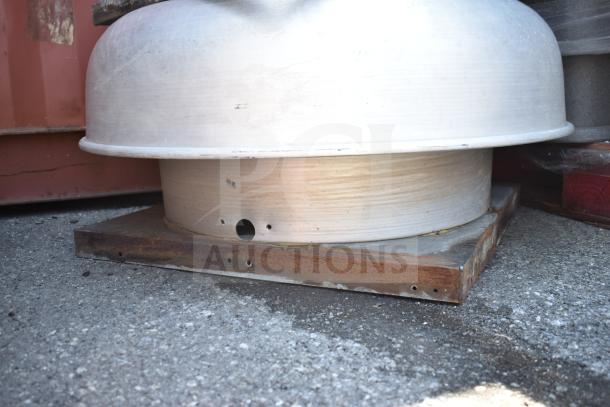Commercial rooftop mushroom exhaust fan with a domed top, metallic finish, and rust on the base. Used condition.