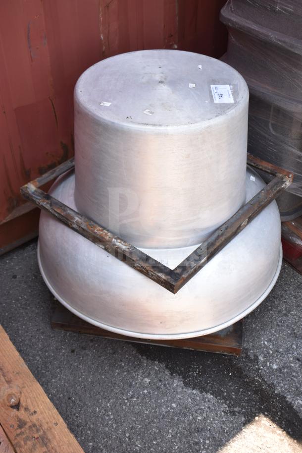 Commercial rooftop mushroom exhaust fan in used condition, metallic finish with visible wear, mounted on a square frame.