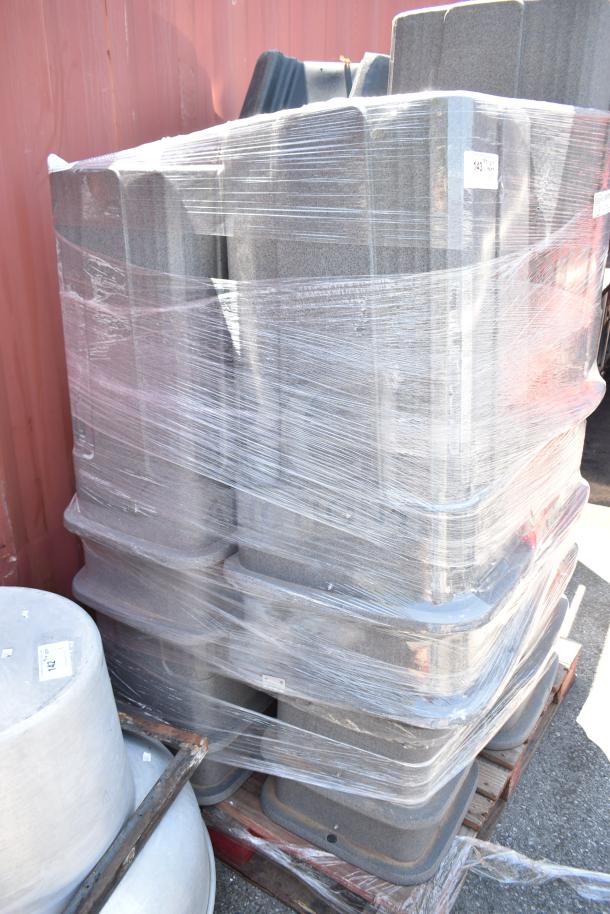 15 gray poly trash cans, pallet wrapped, unused. Durable, stackable design for efficient storage and transport.