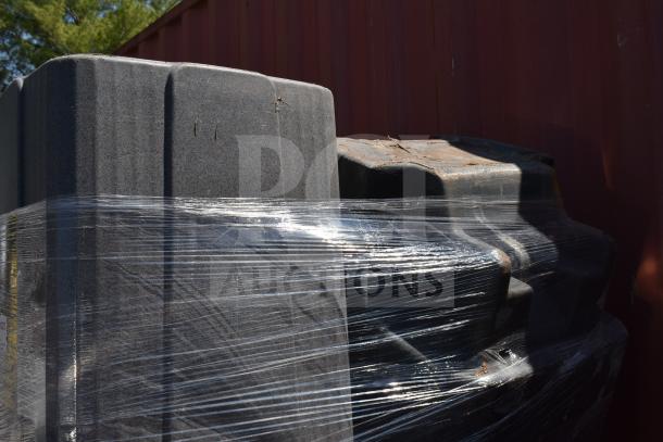 Stack of 15 gray poly trash cans wrapped in plastic, showing durable design and good condition. Auction lot.