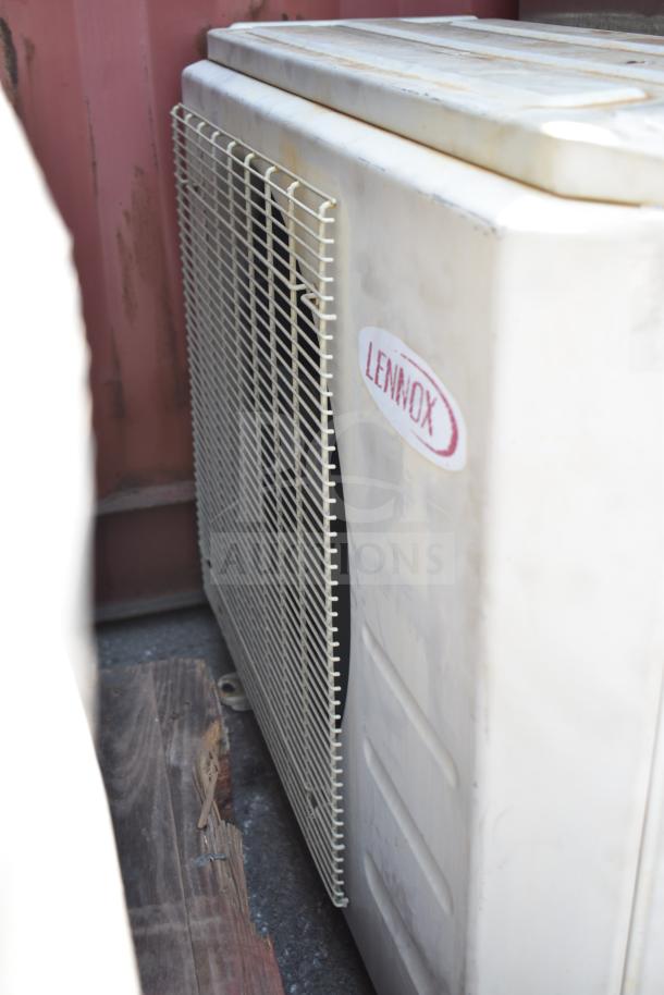 Lennox MPB018S4S-1P single zone heat pump, visible logo, off-white with protective grill, in used condition.