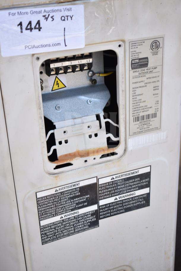 Lennox MPB018S4S-1P single zone heat pump, open panel showing wiring and safety labels, slight rust on panel edge.