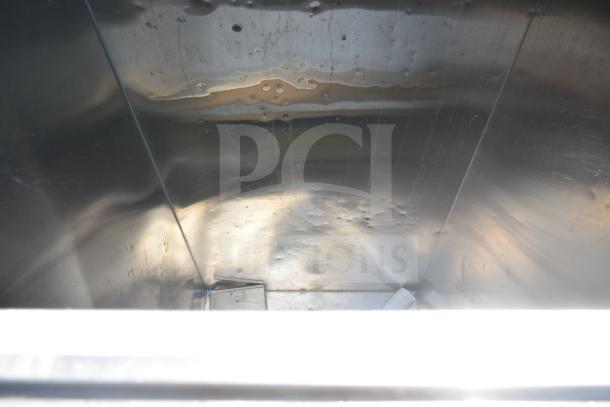 MGR Commercial Ice Bin interior showing stainless steel construction with some surface wear and denting. Suitable for high-capacity use.